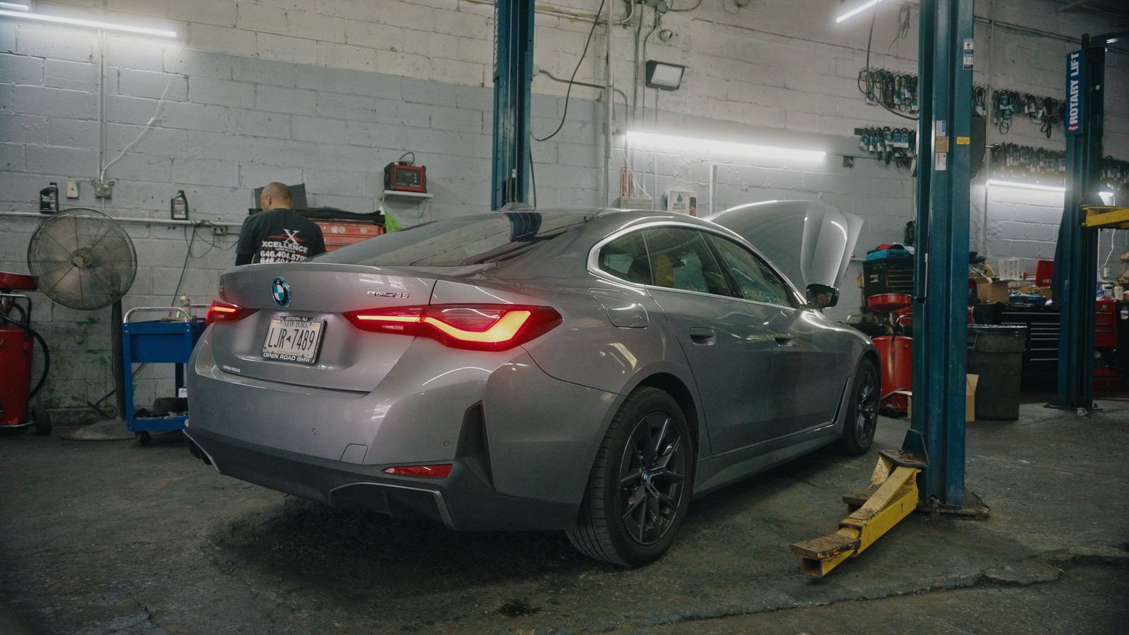 Silver BMW in for service with the hood open
